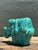This charming vintage ceramic sculpture captures a moment of serene tranquility, featuring a young boy peacefully...