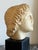 A refined vintage plaster bust inspired by the sculptural portraiture of Ancient Rome, dating to the 1970s. Capturing the...