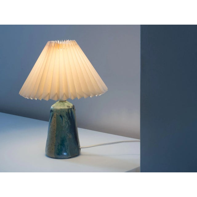 Danish ceramic lamp from the 1960s. Designer and manufacturer unknown. This ceramic lamp has many shades of blue, blue-...