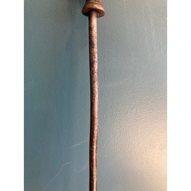 Add a distinctive piece to your vintage finds with this unique cast iron fireplace poker, featuring a figural design of a...