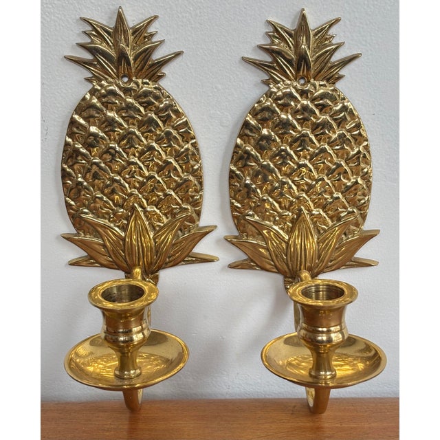 Welcome your guests with this fine pair of vintage brass pineapple candle sconces. Please see condition details noted....