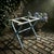 Add vintage charm and practical function to your home with this folding wooden luggage rack featuring a soft blue painted...