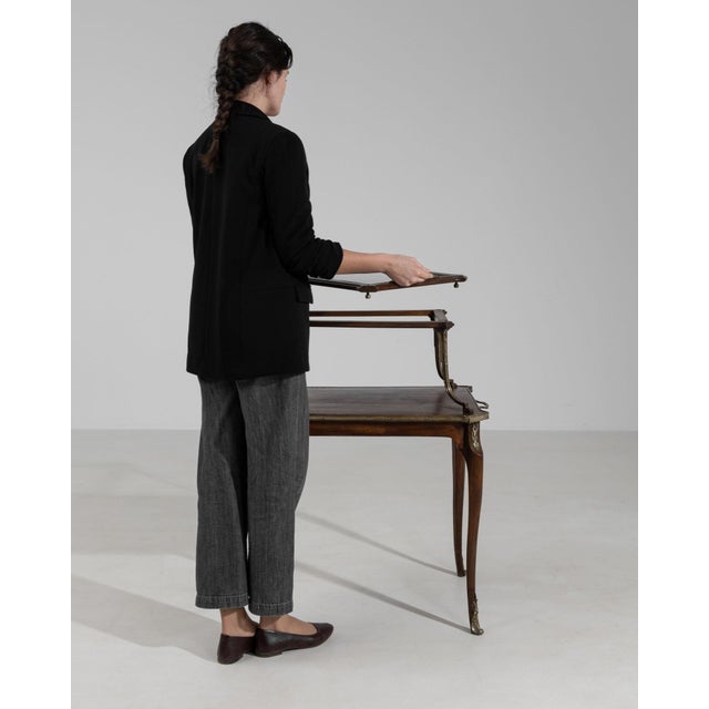 Two-tier walnut dessert stand in Rich Walnut Brown. The rich walnut brown surface highlights turned gallery edges, slender...