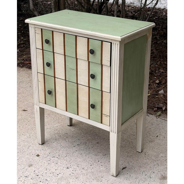 Fun handpainted slightly distressed 3 drawer chest. Great for a child's room.