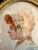 A stunning late 19th-century miniature portrait of a young woman in profile, elegantly housed in an ornate Louis XVI style...