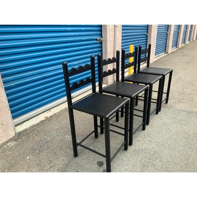 country French solid oak counter stools. Stools are done in a rich satin/ebony finish. . The stools were custom made. The...