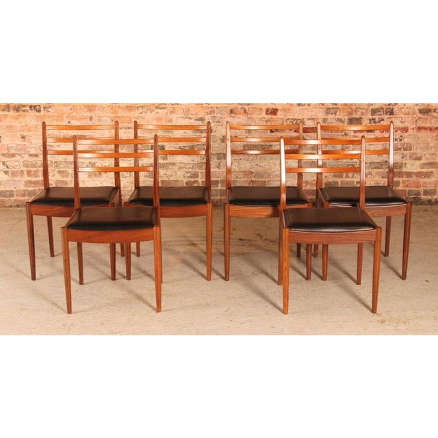 A set of six midcentury g plan dining chairs circa 1960s. Black vinyl seats in excellent condition. H: 83.5cm w: 49cm d:...