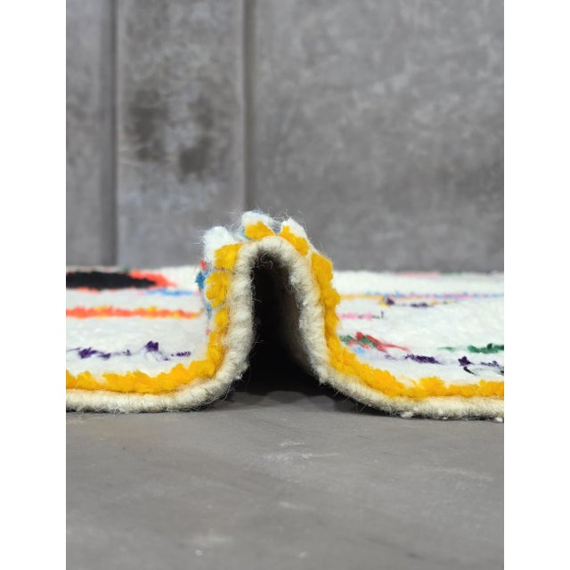 Artful Azilal Rug – Handmade Moroccan Colorful Wool Rug This handmade Azilal rug is a vibrant fusion of traditional Berber...