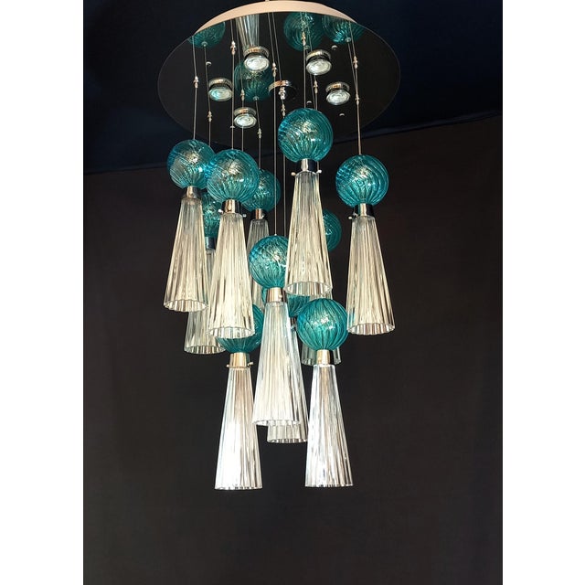 Rare and imperial vintage art deco chandelier from the 1970s with led lights. This ceiling lamp, directly attached to the...