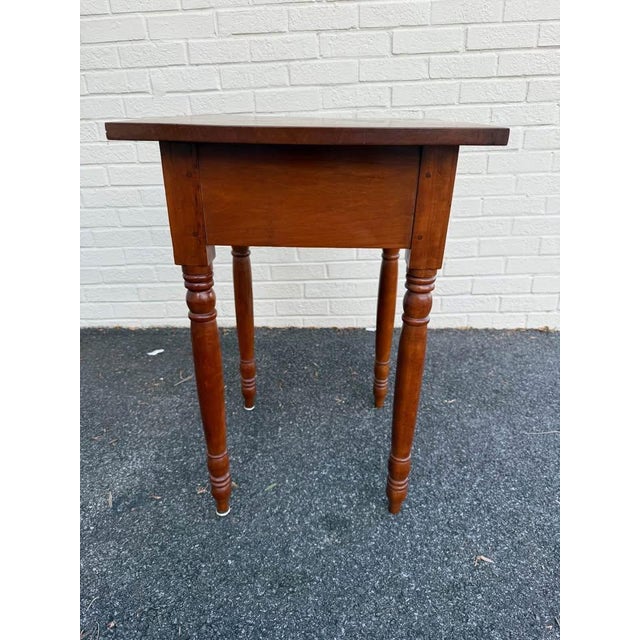 19th Century Antique American cherry stand table with drawer and turned legs. Dovetail joint construction, sturdy and...