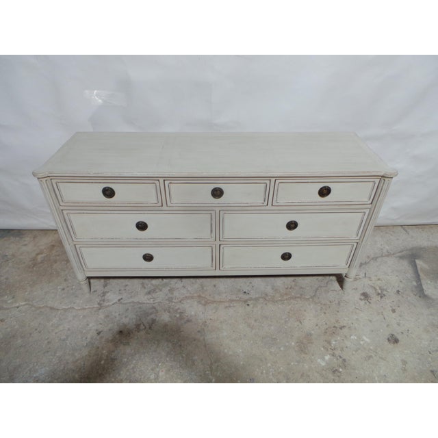 This is a unique 7 drawer Gustavian Style dresser. its been restored and repainted with Milk Paints "Oyster White"