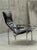 A stunning and rare lounge chair, a design classic by Hans Eichenberger for Strässle International, in black saddle...