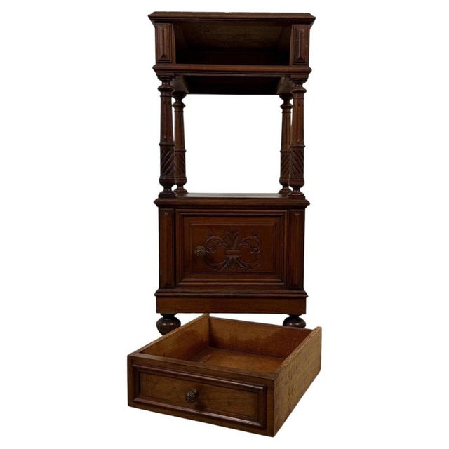 Fine 19th Century French Walnut Cabinet with Marble Top Material: Walnut, Marble, Ceramic, Metal Hardware An elegant 19th-...