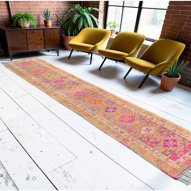 An exceptional mid-century statement piece, this hand-knotted wool runner rug originates from Southeastern Anatolia, woven...
