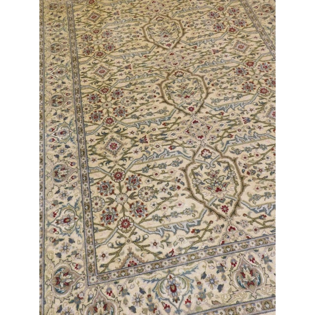 Genuine handmade rug. Wool pile knotted on cotton foundation. Soft cream field within cream border.