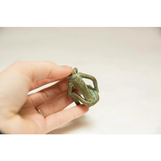 Vintage handmade African oxidized bronze sitting monkey. Circa mid 20th century and possibly older, this piece has such...