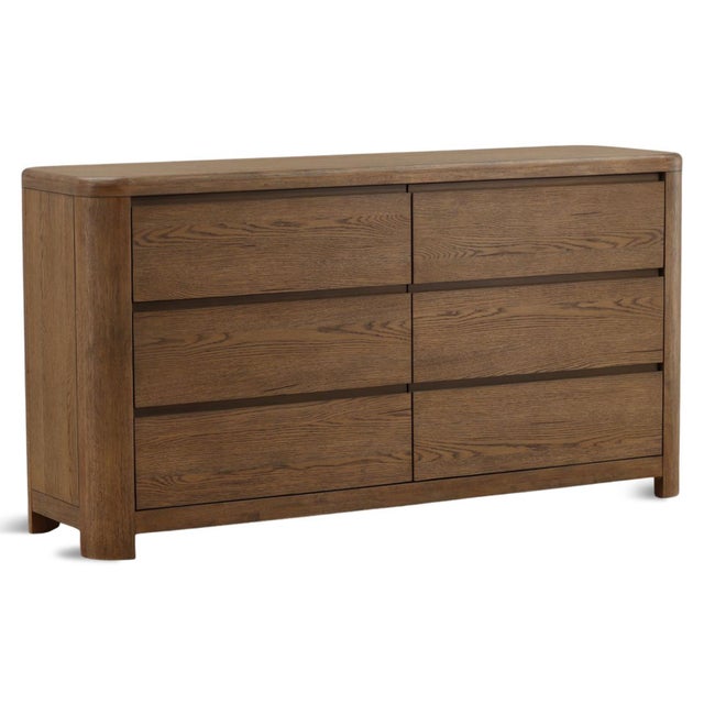 Simple modern brown oak dresser with six drawers. Minimalist design with rounded edges for a softer feel. Each will vary...