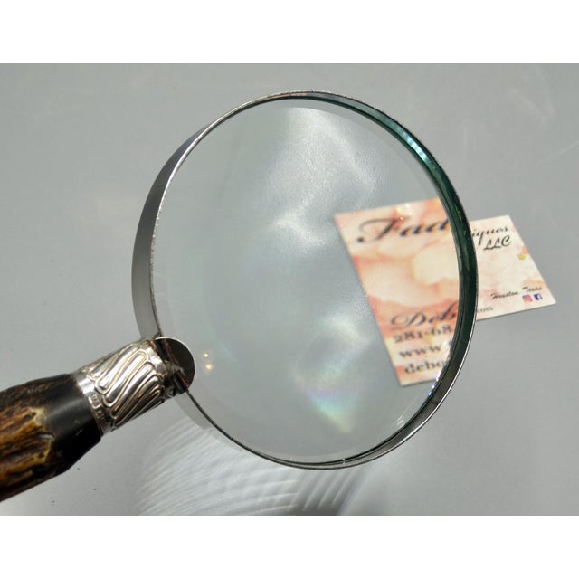 A fine quality antique English natural stag horn handled magnifying glass with sterling silver mounts, hallmarked Joseph...
