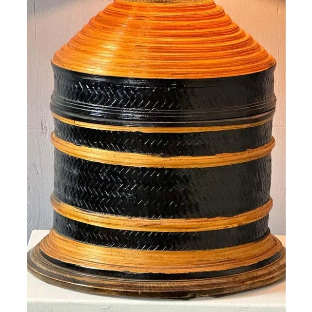 This decorative bicolor blonde and black colour cane accent table lamp emits a special warmth and comfort adding value to...