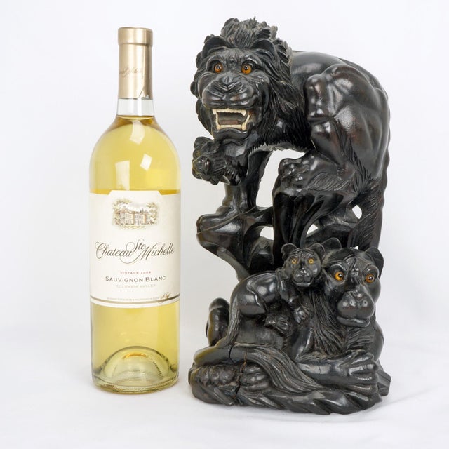 A large vintage Japanese sculpture / statue / okimono in blackened and carved wood, depicting 1 male lion, 2 cubs and a...