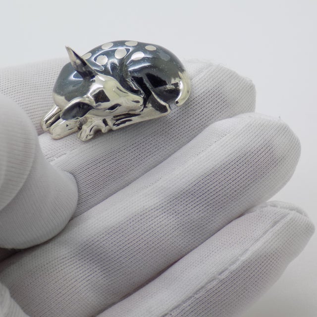 A delicate vintage miniature of a deer, meticulously handmade in Italy during the 1980s and 1990s in sterling silver...