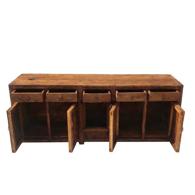 This late 17th century sideboard was handmade from sturdy, seasoned elm and features a warm, natural honey finish with a...