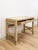 This petite desk by Ficks Reed showcases the brand's signature faux bamboo construction, finished in a soft gray and...