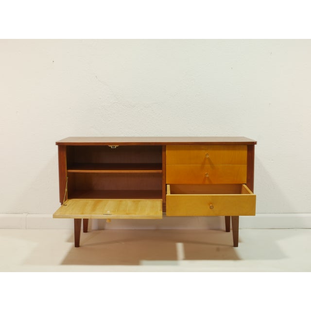 A beautiful vintage sideboard from the 1960s – timeless, elegant, and with typical mid-century charm. The contrast between...