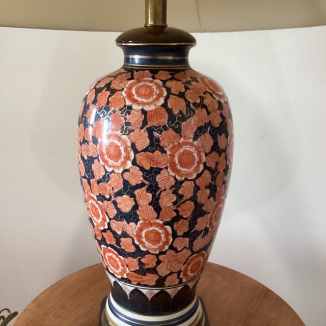 Frederick Cooper Japanese Imari porcelain mantel vase lamps mounted on carved wood stands are highly collectible statement...