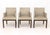 Set of Six Christian Liaigre Style Dining Armchairs, with taupe upholstery on wood legs. 33" H x 24.5" W x 25" D; seat:...