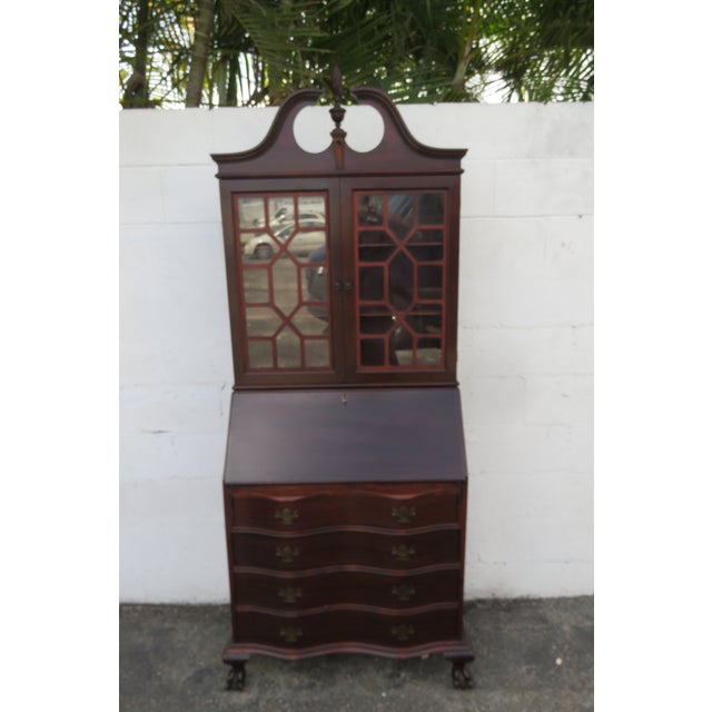 This beautiful Secretary Desk is made out of wood, solid wood, mahogany, veneer, and glass. It has a Traditional style and...