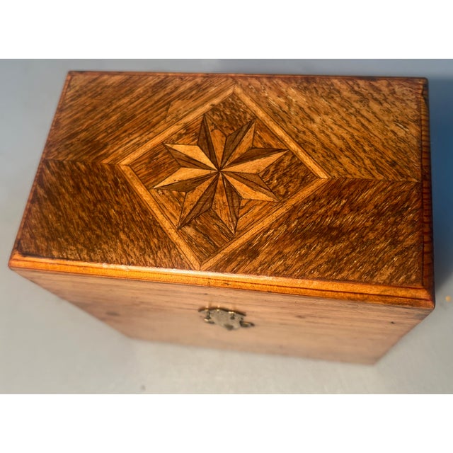 Own a piece of pharmaceutical history from the 1800s. Included is a miniature tiger oak box with a pinwheel inlay and two...