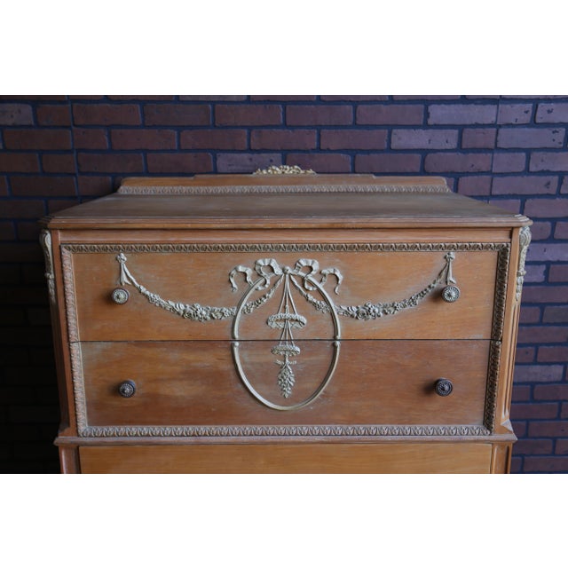 Shabby Chic perfection! Sweet swag and bow tie applique adorns the top two drawers. Top to bottom the design features...