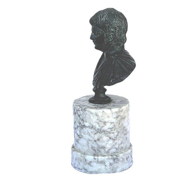 Grand Tour Bronze Portrait Bust of a Roman Emperor. Bust features a bronze draped male figure with his toga secured at...