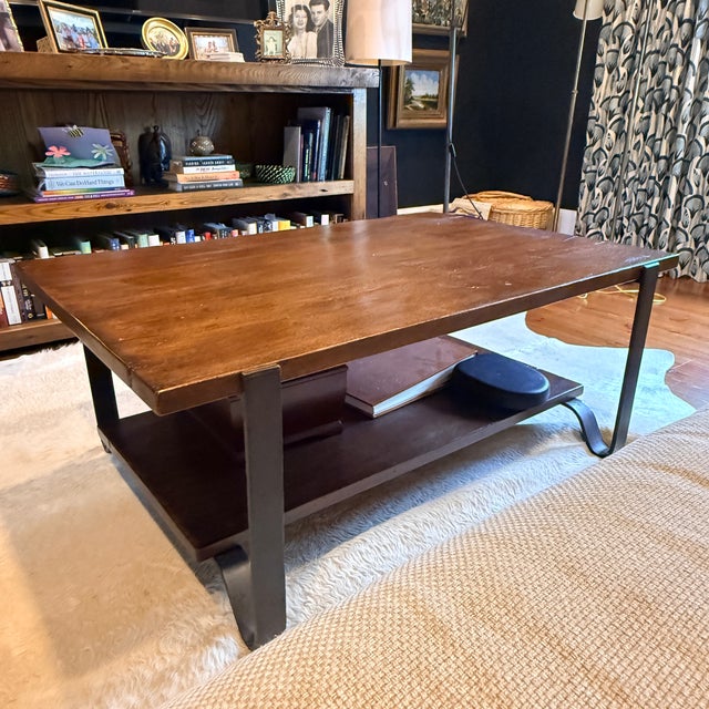 Sarreid Leonard Lodge Cocktail Table Two tier reclaimed wood coffee table with distinct metal band legs. 45” x 30”x 18”