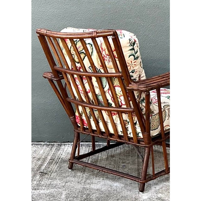 This vintage stick rattan lounge chair pairs a distinctive lattice design with the relaxed, easygoing spirit of mid-20th-...
