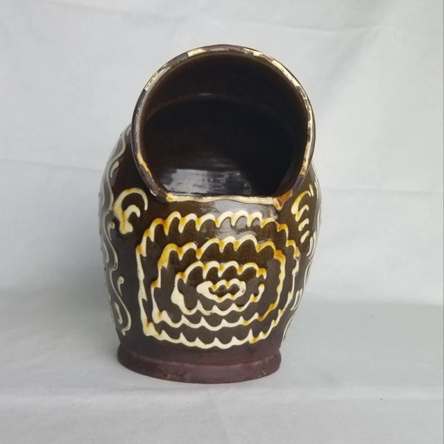 This unusual earthenware vessel is from the 17th or 18th century, made in England. We do not know the original purpose,...