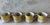 Vintage set of 4 coffee cups in the Somerset pattern by Georges Briard featuring a white body, a bright yellow exterior...