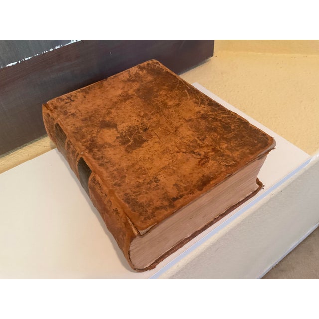 Antique leather-bound dictionary. Some loose pages at the front of the book. Please review pictures as to its current...