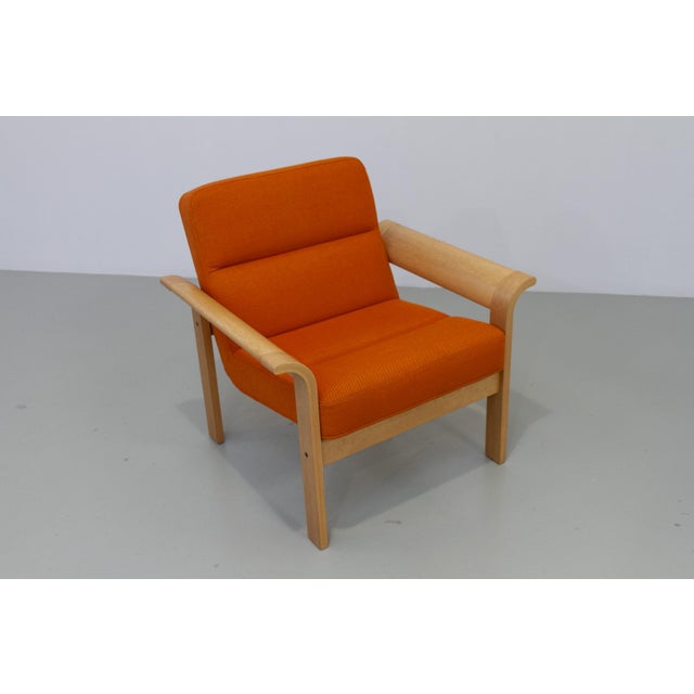 Danish orange oak botium lounge chair by magnus olesen, 1970s. beautifully crafted scandinavian mid-century modern oak...