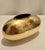 Welcome to Turtle and Crane. Allow us to introduce you to this exquisite Vintage Oval Hand Hammered Polished Brass Vase...