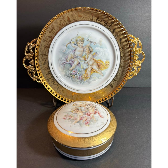 Beautiful vintage hand decorated Limoges dresser box and tray. Features cherubs in the clouds surrounded by a gold border...