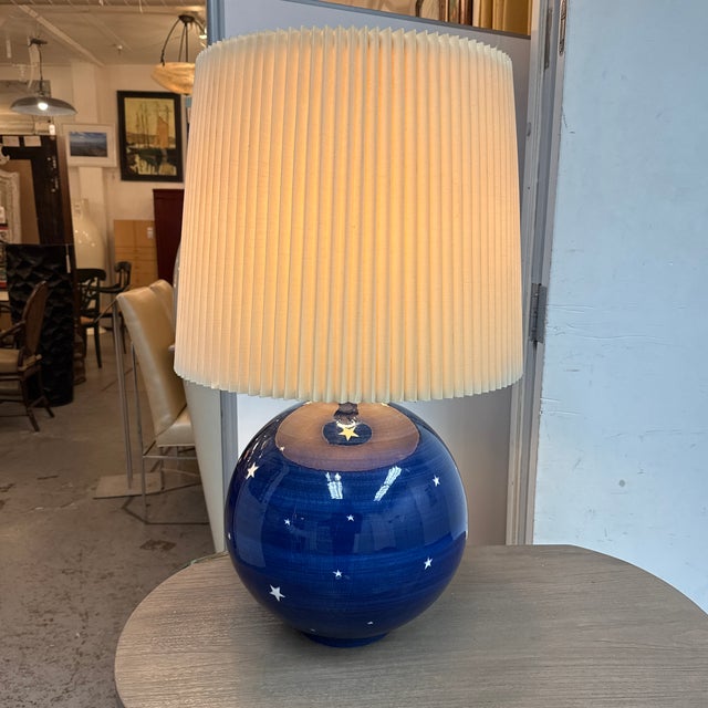 Design Plus Gallery presents a Celestial Artisan Ceramic Globe Table Lamp. It has a handmade glazed ceramic globe body...