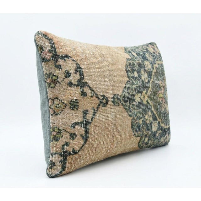 This beautiful 16'' x 24'' pillow cover was made from an authentic Turkish rug. Bright colors of wool adorn the front of...