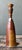 This vintage handcrafted studio pottery bottle exemplifies the refined artistry and expressive character of mid-20th-...