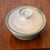 Art pottery lidded serving bowl / dish by unknown artist. Appears to be signed by Ceal or Ceel on the bottom of the piece....