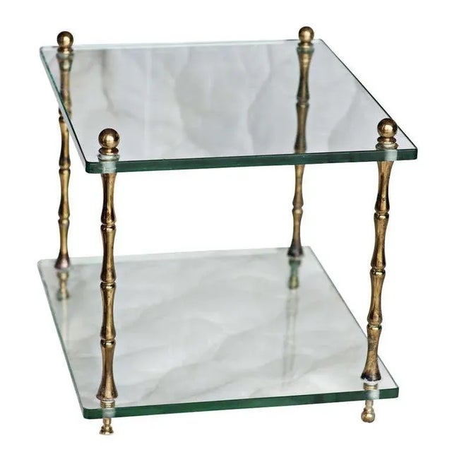 A pair of square occasional tables in 1/2" thick glass with brass faux bamboo legs. American, circa 1960.