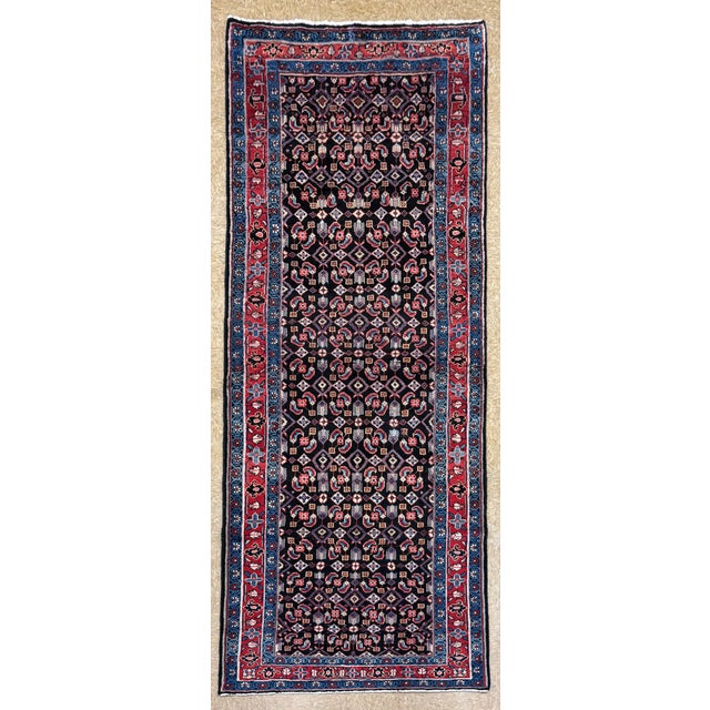 Hand-knotted runner from the Arak (Sultanabad) region of central-western Iran, featuring a dense allover Herati (Mahi)...