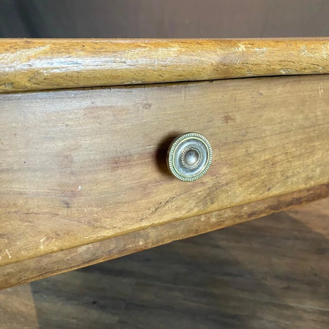 Classic 19th century country French provincial farmhouse dining table crafted from rich walnut. The ends are fitted with...