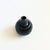 A mid century black pottery bud vase. Decorated with interchanging bands of glossy and matte glazes. A small opening at...